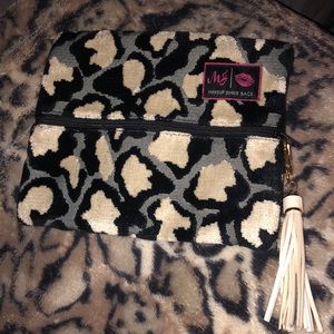 Used makeup junkie bag- black and white leopard